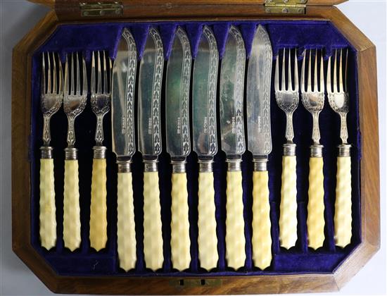A cased set of twelve pairs of Victorian ivory handled silver fish eaters by Joseph Rodgers & Sons, Sheffield, 1869